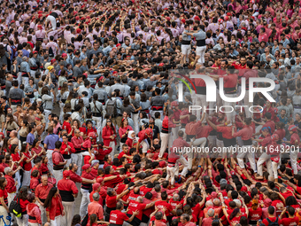 Members of the colla Nens del Vendrell build a human tower during the Concurs de Castells competition in Tarragona, Spain, on October 6, 202...