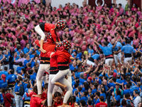 Children of the colla Castellers de Barcelona build the final part of the human tower during the Concurs de Castells competition in Tarragon...