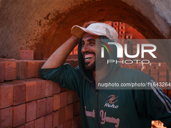 Red brick factory workers in Fayoum, Egypt, on October 5, 2024. (