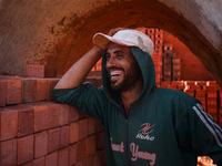 Red brick factory workers in Fayoum, Egypt, on October 5, 2024. (