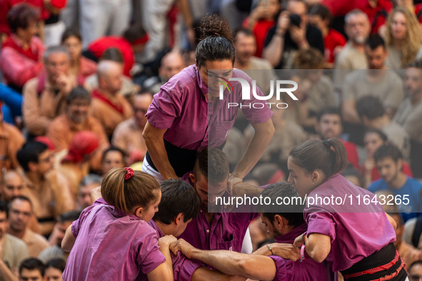 Members of the colla Moixiganguers d'Igualada build a human tower during the Concurs de Castells competition in Tarragona, Spain, on October...