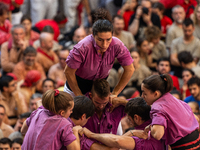 Members of the colla Moixiganguers d'Igualada build a human tower during the Concurs de Castells competition in Tarragona, Spain, on October...