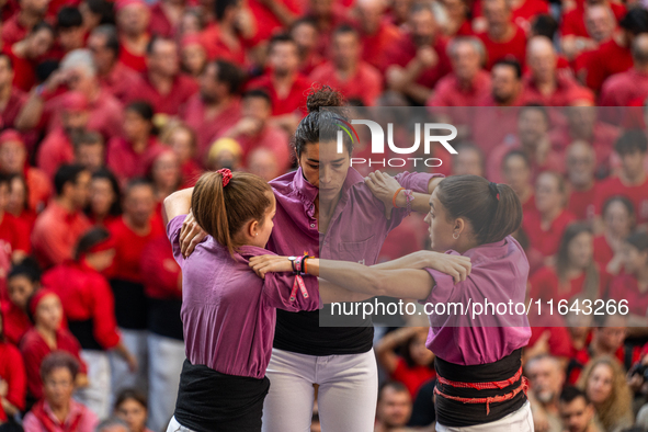 Members of the colla Moixiganguers d'Igualada build a human tower during the Concurs de Castells competition in Tarragona, Spain, on October...