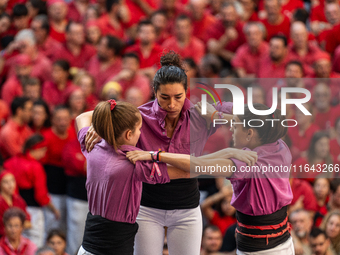 Members of the colla Moixiganguers d'Igualada build a human tower during the Concurs de Castells competition in Tarragona, Spain, on October...