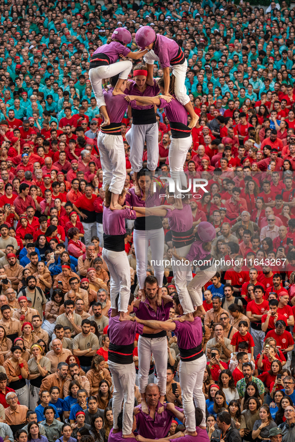 Members of the colla Moixiganguers d'Igualada build a human tower during the Concurs de Castells competition in Tarragona, Spain, on October...