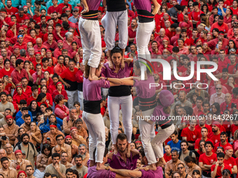 Members of the colla Moixiganguers d'Igualada build a human tower during the Concurs de Castells competition in Tarragona, Spain, on October...