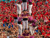 Members of the colla Moixiganguers d'Igualada build a human tower during the Concurs de Castells competition in Tarragona, Spain, on October...