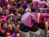 Members of the colla Moixiganguers d'Igualada celebrate the victory after building a human tower during the Concurs de Castells competition...