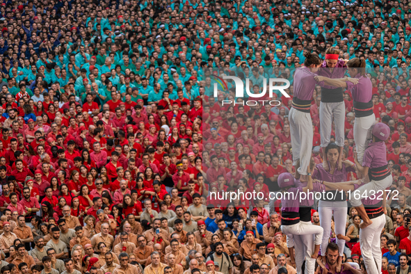 Members of the colla Moixiganguers d'Igualada build a human tower during the Concurs de Castells competition in Tarragona, Spain, on October...