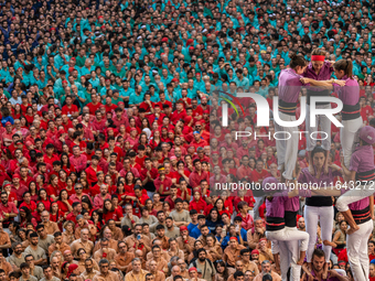 Members of the colla Moixiganguers d'Igualada build a human tower during the Concurs de Castells competition in Tarragona, Spain, on October...