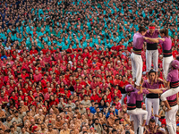 Members of the colla Moixiganguers d'Igualada build a human tower during the Concurs de Castells competition in Tarragona, Spain, on October...