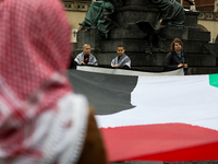 Participants in a pro-Palestinian protest gather on the Main Square and then proceed to the US Consulate and the Jagiellonian University in...