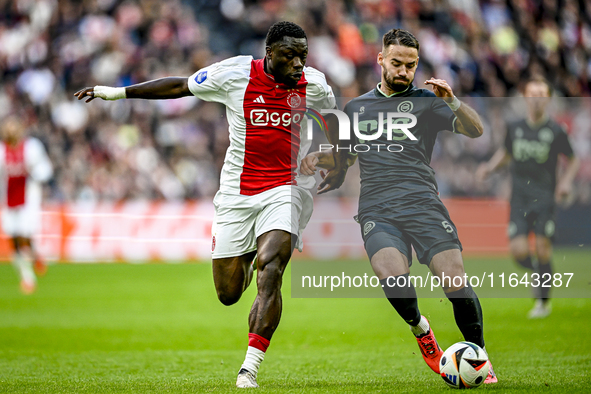 AFC Ajax Amsterdam forward Brian Brobbey and FC Groningen defender Marco Rente play during the match between Ajax and Groningen at the Johan...