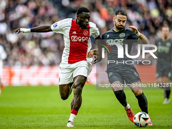 AFC Ajax Amsterdam forward Brian Brobbey and FC Groningen defender Marco Rente play during the match between Ajax and Groningen at the Johan...