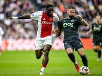 AFC Ajax Amsterdam forward Brian Brobbey and FC Groningen defender Marco Rente play during the match between Ajax and Groningen at the Johan...