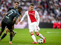 AFC Ajax Amsterdam forward Mika Godts plays during the match between Ajax and Groningen at the Johan Cruijff ArenA for the Dutch Eredivisie...