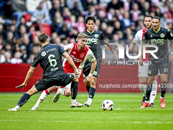 FC Groningen midfielder Stije Resink and AFC Ajax Amsterdam midfielder Kenneth Taylor play during the match between Ajax and Groningen at th...