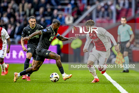 FC Groningen defender Leandro Bacuna and AFC Ajax Amsterdam forward Mika Godts play during the match between Ajax and Groningen at the Johan...