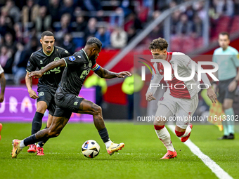 FC Groningen defender Leandro Bacuna and AFC Ajax Amsterdam forward Mika Godts play during the match between Ajax and Groningen at the Johan...