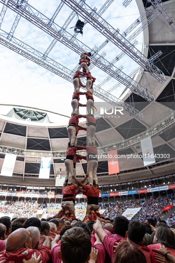 Members of Colla Vella dels Xiquets de Valls build a human tower during the Concurs de Castells competition in Tarragona, Spain, on October...