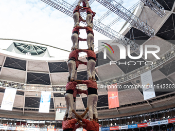 Members of Colla Vella dels Xiquets de Valls build a human tower during the Concurs de Castells competition in Tarragona, Spain, on October...