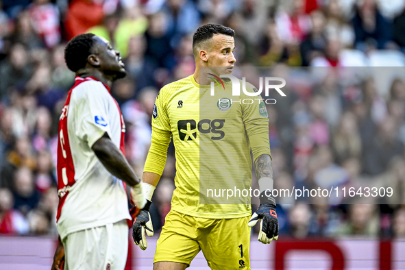 AFC Ajax Amsterdam forward Brian Brobbey and FC Groningen goalkeeper Etienne Vaessen participate in the match between Ajax and Groningen at...