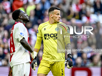 AFC Ajax Amsterdam forward Brian Brobbey and FC Groningen goalkeeper Etienne Vaessen participate in the match between Ajax and Groningen at...