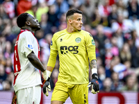 AFC Ajax Amsterdam forward Brian Brobbey and FC Groningen goalkeeper Etienne Vaessen participate in the match between Ajax and Groningen at...