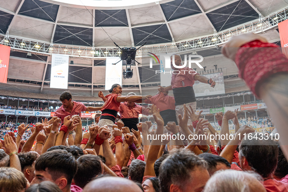 Members of Colla Vella dels Xiquets de Valls celebrate the victory after building a human tower during the Concurs de Castells competition i...