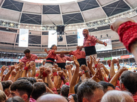 Members of Colla Vella dels Xiquets de Valls celebrate the victory after building a human tower during the Concurs de Castells competition i...