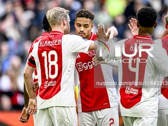 AFC Ajax Amsterdam midfielder Davy Klaassen and AFC Ajax Amsterdam defender Devyne Rensch participate in the match between Ajax and Groninge...