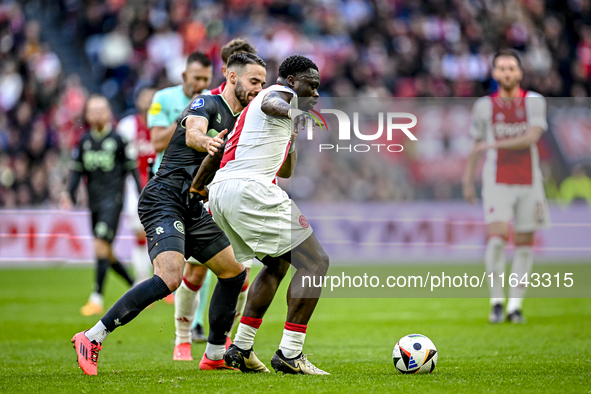 FC Groningen defender Marco Rente and AFC Ajax Amsterdam forward Brian Brobbey play during the match between Ajax and Groningen at the Johan...