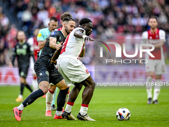 FC Groningen defender Marco Rente and AFC Ajax Amsterdam forward Brian Brobbey play during the match between Ajax and Groningen at the Johan...