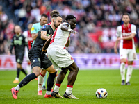 FC Groningen defender Marco Rente and AFC Ajax Amsterdam forward Brian Brobbey play during the match between Ajax and Groningen at the Johan...