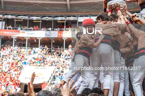 Members of Xiquets de Reus celebrate the victory after building a human tower during the Concurs de Castells competition in Tarragona, Spain...