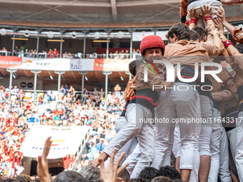 Members of Xiquets de Reus celebrate the victory after building a human tower during the Concurs de Castells competition in Tarragona, Spain...