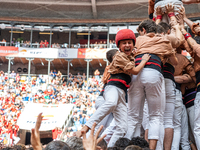 Members of Xiquets de Reus celebrate the victory after building a human tower during the Concurs de Castells competition in Tarragona, Spain...