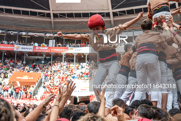 Members of Xiquets de Reus celebrate the victory after building a human tower during the Concurs de Castells competition in Tarragona, Spain...