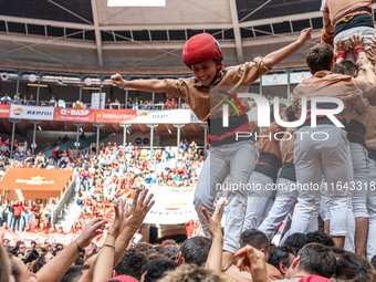 Members of Xiquets de Reus celebrate the victory after building a human tower during the Concurs de Castells competition in Tarragona, Spain...