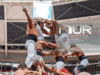 Members of Xiquets de Reus celebrate the victory after building a human tower during the Concurs de Castells competition in Tarragona, Spain...