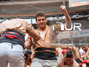 Members of Xiquets de Reus celebrate the victory after building a human tower during the Concurs de Castells competition in Tarragona, Spain...