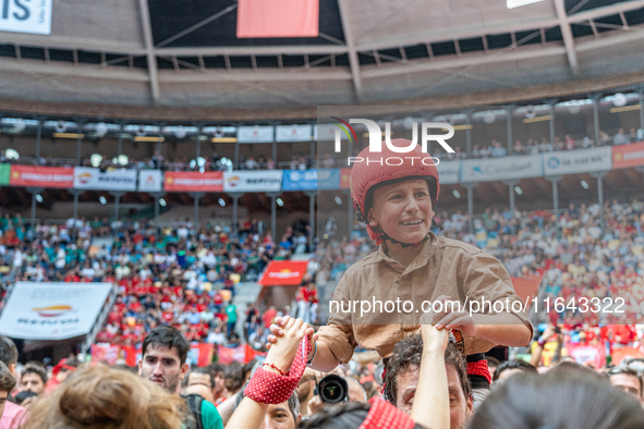 A little girl member of Xiquets de Reus cries with happiness after successfully dismantling a human tower during the Concurs de Castells com...