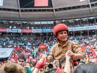 A little girl member of Xiquets de Reus cries with happiness after successfully dismantling a human tower during the Concurs de Castells com...