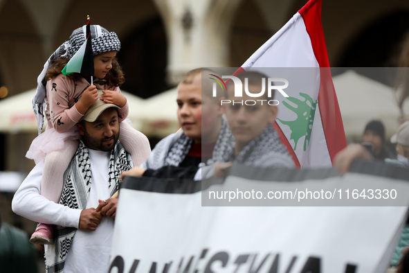 Participants in a pro-Palestinian protest gather on the Main Square and then proceed to the US Consulate and the Jagiellonian University in...