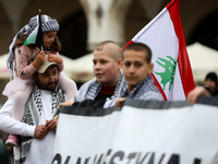 Participants in a pro-Palestinian protest gather on the Main Square and then proceed to the US Consulate and the Jagiellonian University in...