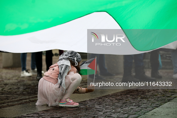 Participants in a pro-Palestinian protest gather on the Main Square and then proceed to the US Consulate and the Jagiellonian University in...