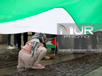 Participants in a pro-Palestinian protest gather on the Main Square and then proceed to the US Consulate and the Jagiellonian University in...