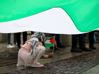 Participants in a pro-Palestinian protest gather on the Main Square and then proceed to the US Consulate and the Jagiellonian University in...