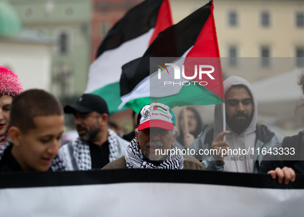 Participants in a pro-Palestinian protest gather on the Main Square and then proceed to the US Consulate and the Jagiellonian University in...