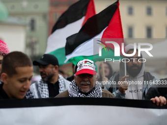 Participants in a pro-Palestinian protest gather on the Main Square and then proceed to the US Consulate and the Jagiellonian University in...